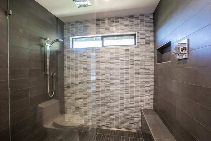 Wine colored tile for shower installation in Palm Coast, Florida home